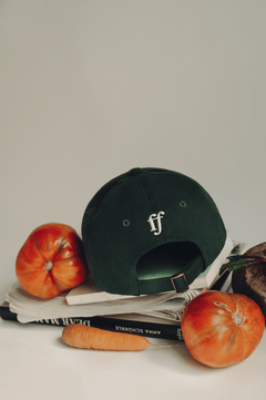 fullfilled Cap on books and vegetables in Berlin