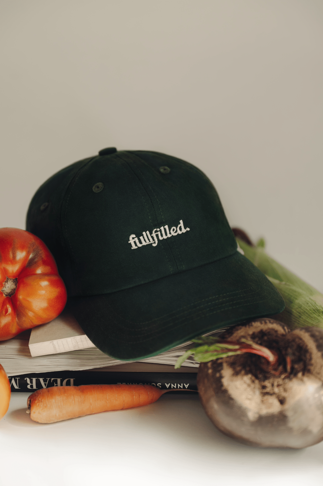 fullfilled Cap on books and vegetables in Berlin